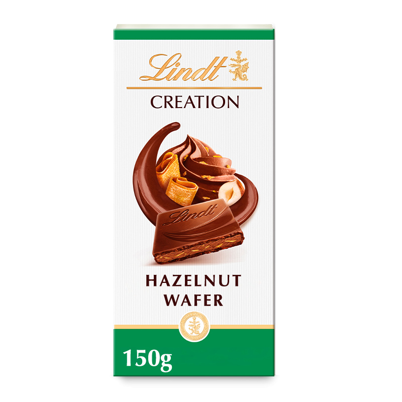 Lindt CREATION Mléčná čokoláda plněná kousky lískových oříšků a oplatky, 150g